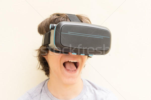 Teenager wearing VR glasses Stock photo © neirfy