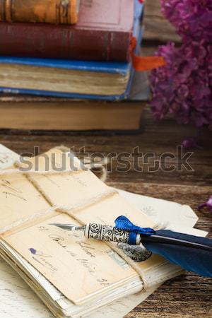 Stock photo: quill pen and antique letters
