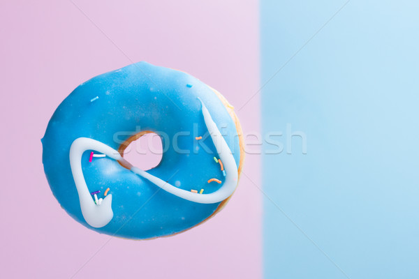 Stock photo: flying doughnuts on blue
