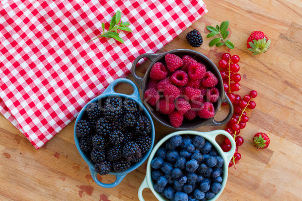 Three bowls of fresh berries Stock photo © neirfy
