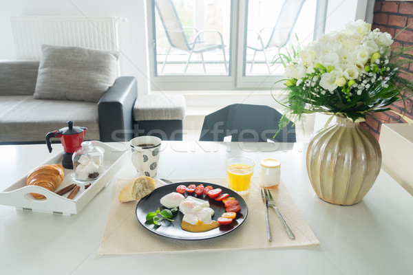 Breakfast with poached eggs Stock photo © neirfy