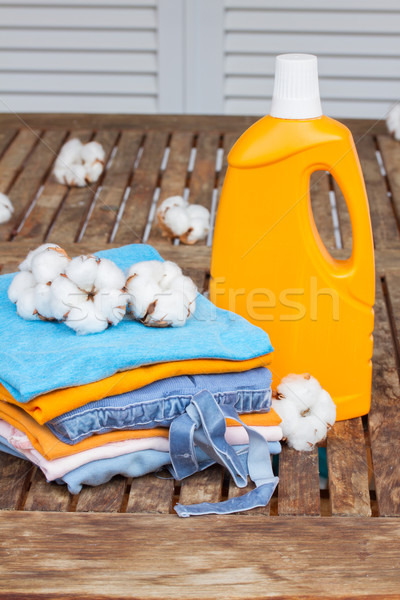 orange bottle of detergent and cotton clothes Stock photo © neirfy