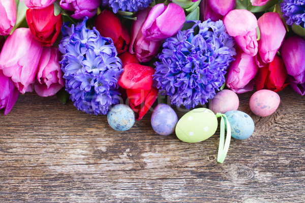 easter eggs with tulips and hyacinth Stock photo © neirfy