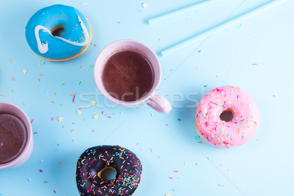 flying doughnuts on blue Stock photo © neirfy