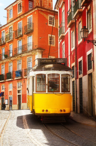 Straßenbahn schmal Straße Lissabon gelb Portugal Stock foto © neirfy