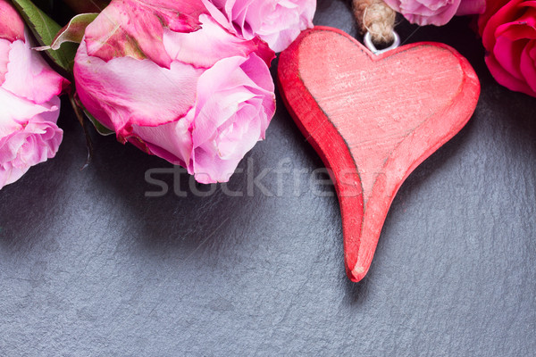 Stock photo: red and pink  roses  on table