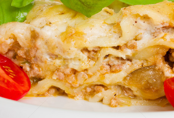 Keresztmetszet lasagna közelkép hús felszolgált tányér Stock fotó © neirfy