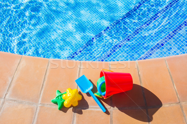 bucket with plastic beach toys  near pool Stock photo © neirfy