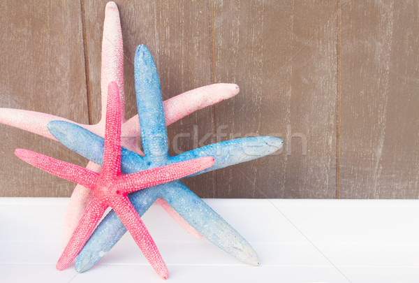 Kırmızı mavi denizyıldızı gri ahşap Stok fotoğraf © neirfy