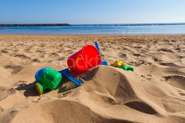 Plage jouets sable mer rive ensoleillée [[stock_photo]] © neirfy