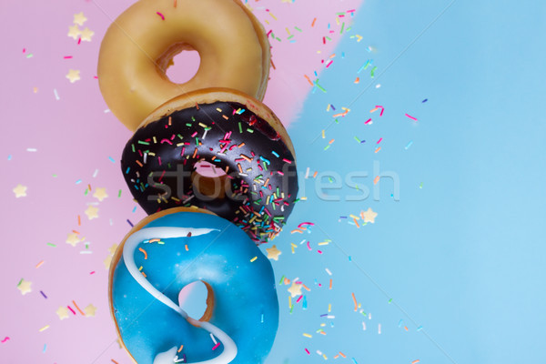 flying doughnuts on blue Stock photo © neirfy