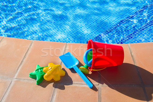 bucket with plastic beach toys  near pool Stock photo © neirfy