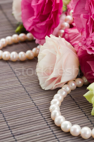 Pink eustoma flowers and pearls Stock photo © neirfy