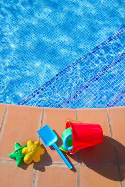 bucket with plastic beach toys  near pool Stock photo © neirfy