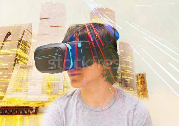 Teenager wearing VR glasses Stock photo © neirfy