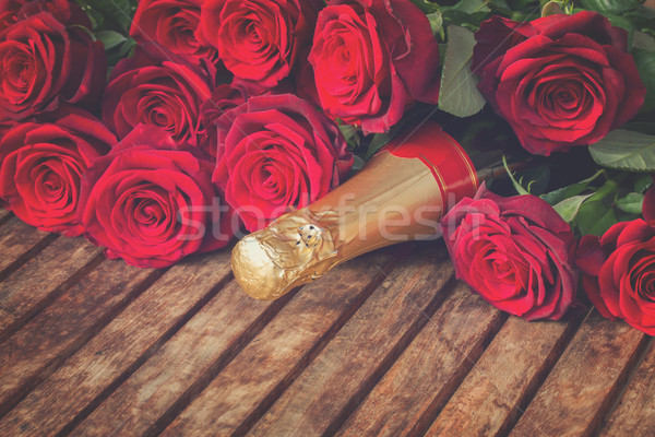 crimson  red  roses with neck of champagne Stock photo © neirfy
