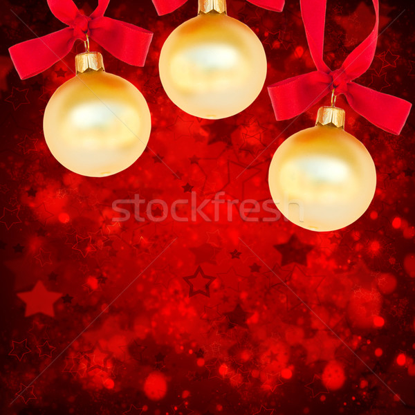 three christmas balls on red background Stock photo © neirfy