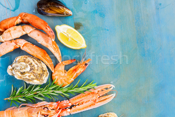 Fresh seafood on blue background Stock photo © neirfy