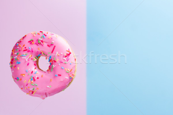 flying doughnuts on blue Stock photo © neirfy