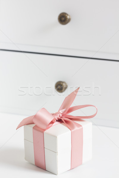 Box with pink ribbon Stock photo © neirfy