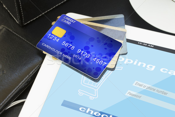 pile of credit cards with virtual shop on screen Stock photo © neirfy