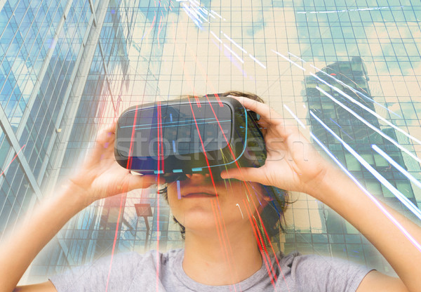 Teenager wearing VR glasses Stock photo © neirfy