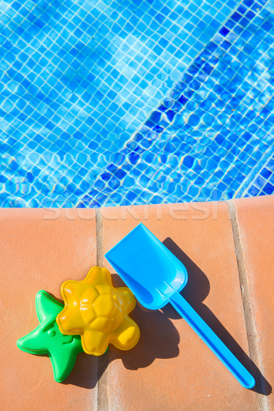  plastic beach toys  near pool Stock photo © neirfy