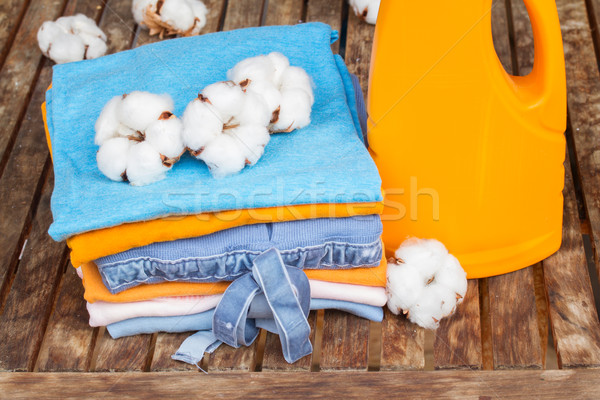 orange bottle of detergent and cotton clothes Stock photo © neirfy