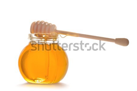 honey in glass pot with stick Stock photo © neirfy