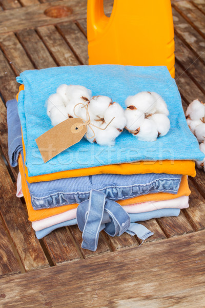 orange bottle of detergent and cotton clothes Stock photo © neirfy