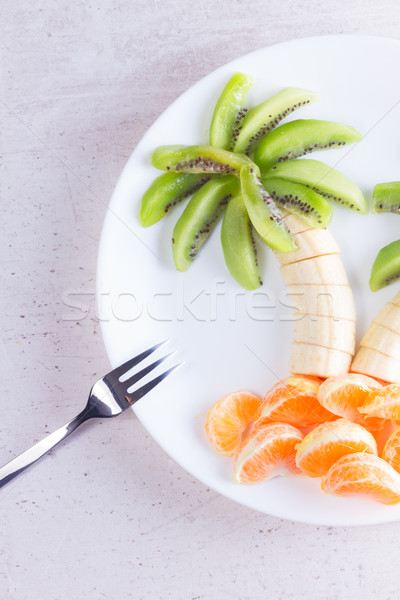 Fruit salad in form of tropical plams Stock photo © neirfy