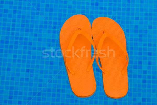 Papucs medence víz narancs lebeg kék Stock fotó © neirfy