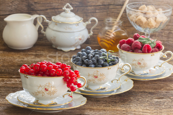 red currant, raspberry and blueberry in cups  Stock photo © neirfy