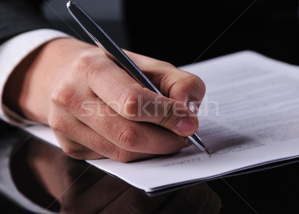 businessman writing on a form  Stock photo © Nejron