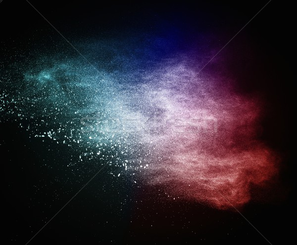 Colourful powder exploding isolated on black Stock photo © Nejron
