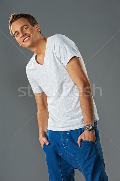 Stylish junger Mann isoliert grau Tanz Mode Stock foto © Nejron