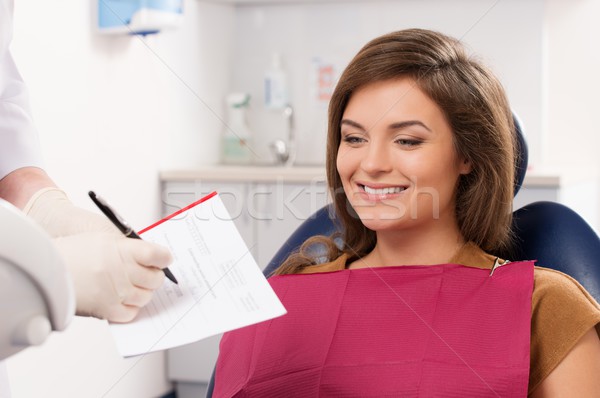 Beautiful young brunette woman visiting dentist  Stock photo © Nejron