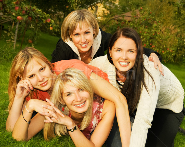 Group of happy friends having fun outdoors Stock photo © Nejron