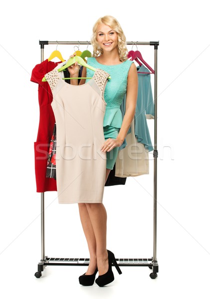 Mosolyog szőke nő választ ruhaakasztó divat Stock fotó © Nejron