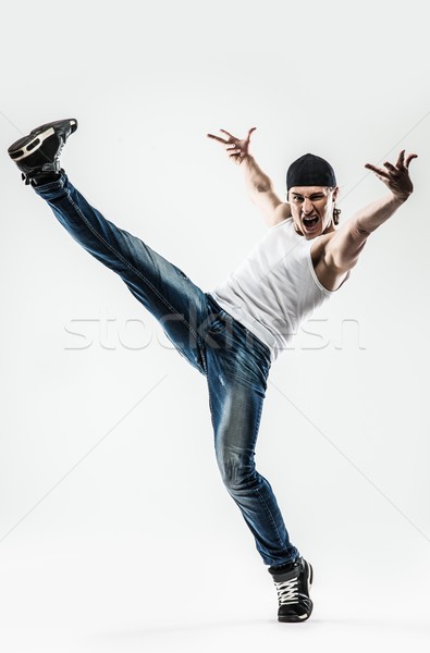 Man dancer showing break-dancing moves isolated on white  Stock photo © Nejron