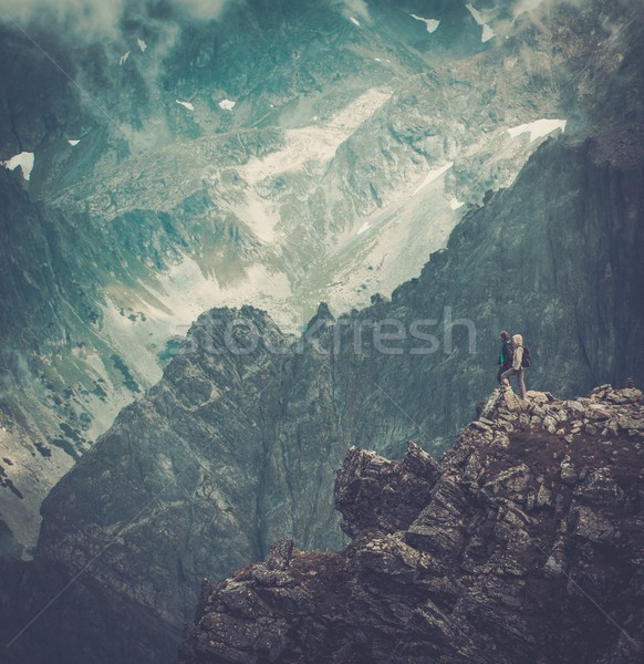Hikers on a top of a mountain  Stock photo © Nejron