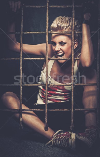 Troubled teenager girl behind bars Stock photo © Nejron