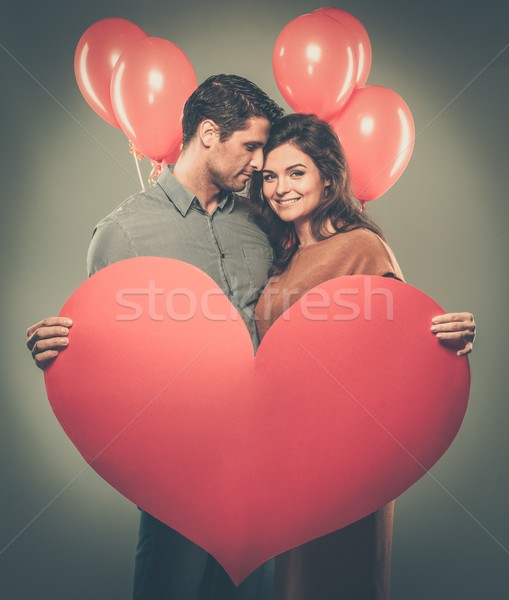 Happy couple handmade paper heart and red balloons  Stock photo © Nejron