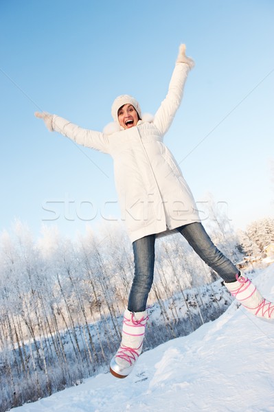 Happy girl jumping in the snow  Stock photo © Nejron
