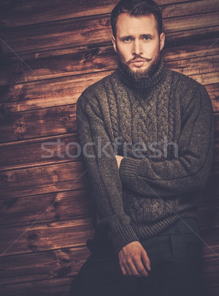 Jóképű férfi visel kardigán fából készült vidéki házbelső Stock fotó © Nejron