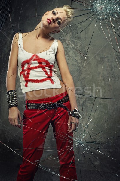 Punk girl behind broken glass Stock photo © Nejron