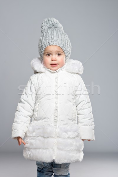 Funny little girl in winter coat Stock photo © Nejron