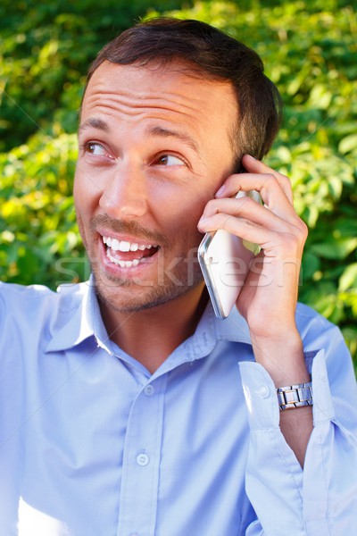 счастливым красивый человека мобильного телефона улице Сток-фото © Nejron
