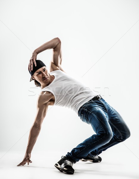 Man dancer showing break-dancing moves isolated on white  Stock photo © Nejron