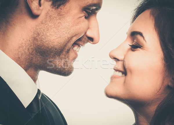 Happy smiling couple in suit and dress  Stock photo © Nejron